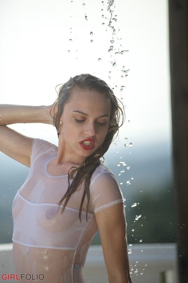 Picture by glambabes-galleries showing 'Thin teen in see thru swimsuit gets caught in a torrential downpour on balcony' number 4