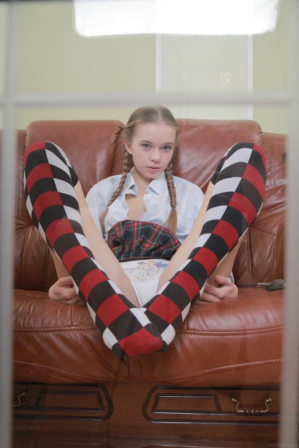 Picture by glambabes-galleries showing 'Sweet teen with pigtails Milena D reveals her bushy twat and poses on a couch' number 16