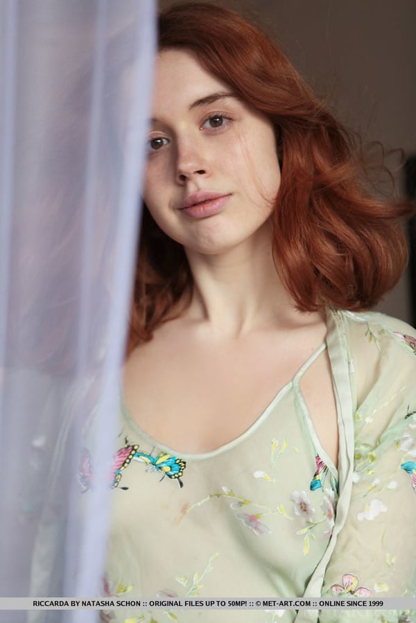 Picture by glambabes-galleries showing 'Natural redhead Riccarda slips off her sheer dress to get naked in her bedroom' number 17