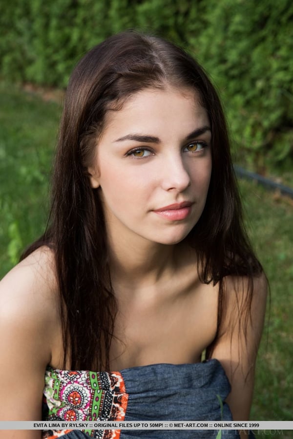 Picture by glambabes-galleries showing 'Pretty brunette Evita Lima displaying full teen breasts and cunt outdoors' number 9