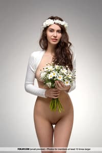 Beautiful teen Alisa I wears a floral crown while modeling totally naked