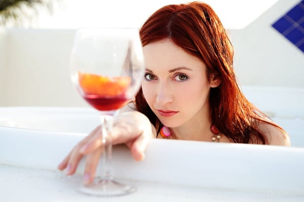 Hot redhead Night A shows her tight ass while emerging from a bathtub