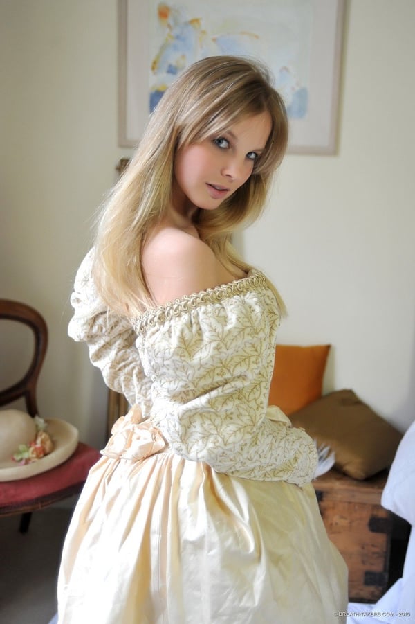 Picture by glambabes-galleries showing 'Blonde girl Rose takes off her petticoat to model in a girdle and nylons' number 11