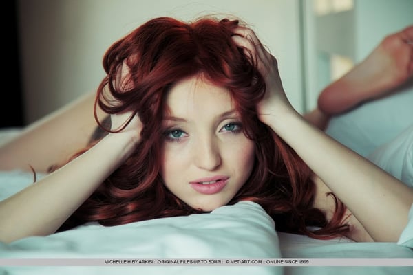 Picture by glambabes-galleries showing 'Young redhead Michelle H touting large breasts and shaved vagina' number 18