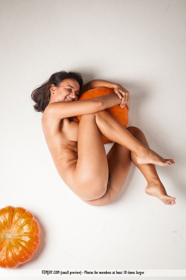 Picture by glambabes-galleries showing 'Naked brunette teen with big naturals and a trimmed bush models among pumpkins' number 13