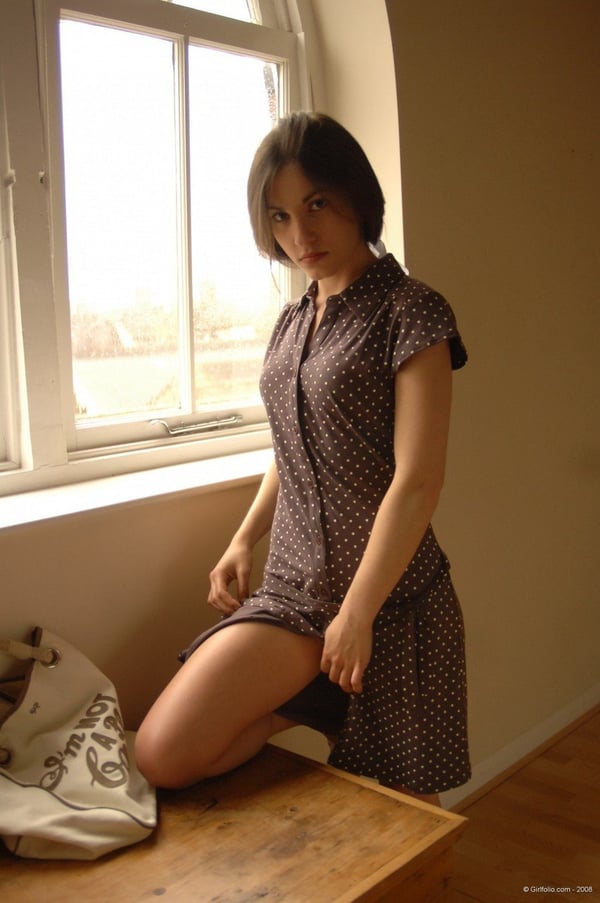 Picture by glambabes-galleries showing 'Solo girl slips off her dress and underthings in front of a window' number 11