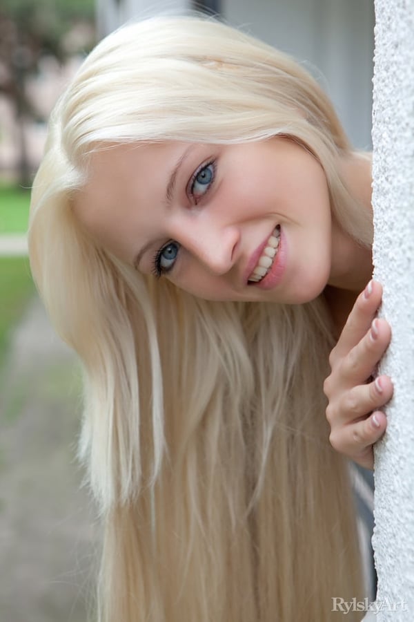 Picture by glambabes-galleries showing 'Innocent blonde teen from Estonia frees her girl parts from her white dress' number 6