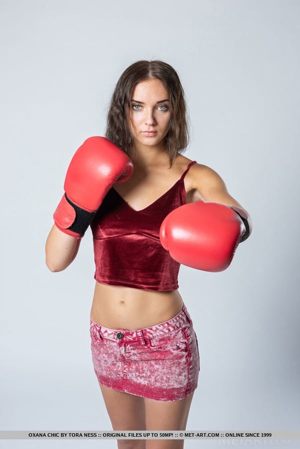 Picture by glambabes-galleries showing 'Sexy teen Oxana Chic removes boxing gloves before getting completely naked' number 1