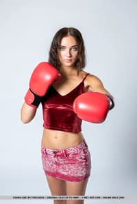 Sexy teen Oxana Chic removes boxing gloves before getting completely naked
