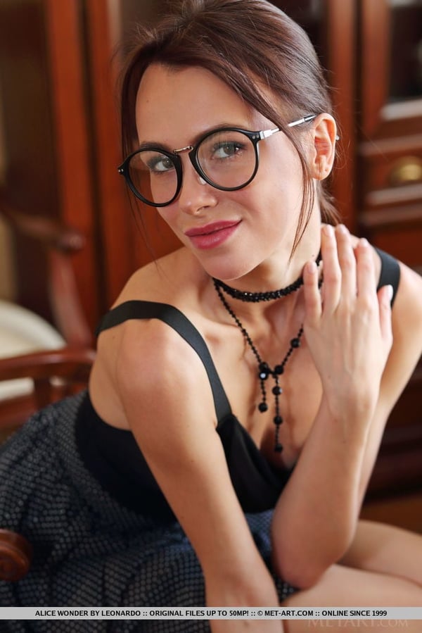 Picture by glambabes-galleries showing 'Nice teen Alice Wonder takes off her glasses and dress to pose totally naked' number 17