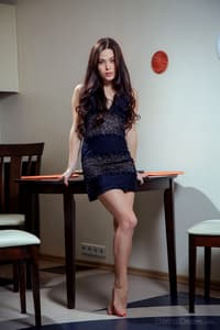 European teen Amelie B undresses in her kitchen for nude posing