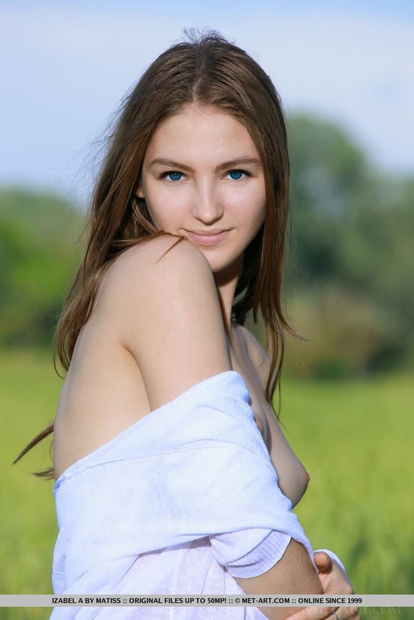Picture by glambabes-galleries showing 'Nice teen Izabel A holds a flower after getting naked in a field' number 15