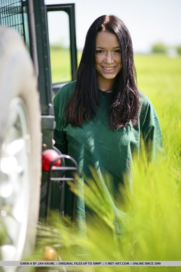 Dark haired girl Gwen A strips naked on top of a Land Rover on safari