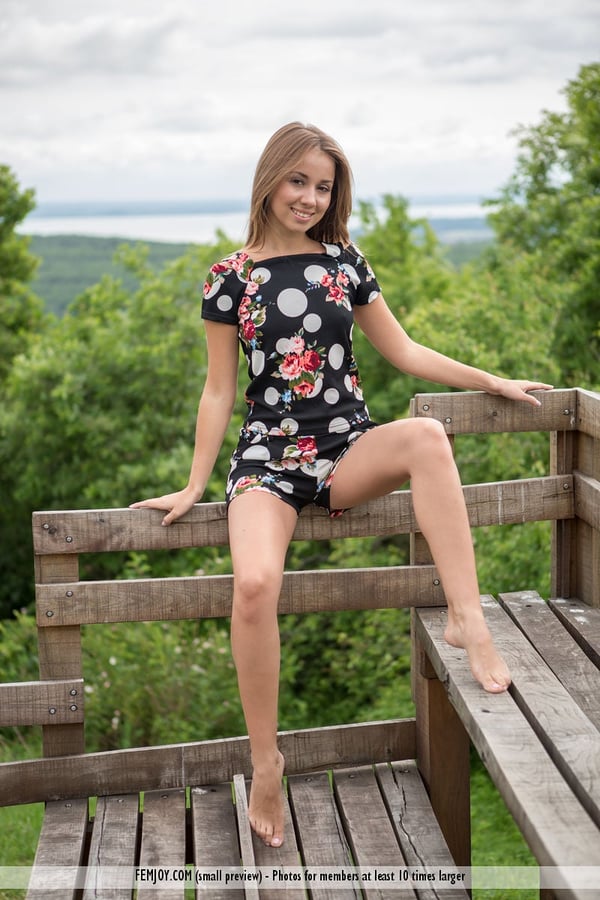 Barefoot teen Linda A gets totally naked at a lookout spot in the woods
