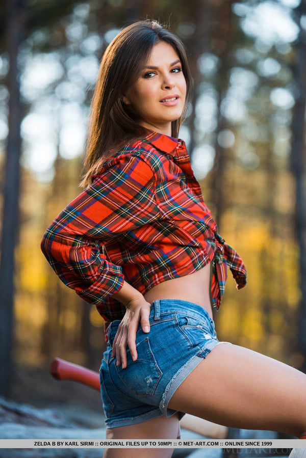 Picture by glambabes-galleries showing 'Hot teen Zelda B lays down her axe to get totally naked by cut logs' number 14