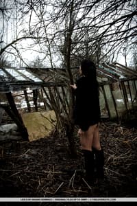 Dark haired teen Lexi B fingers her pussy by abandoned buildings in the woods