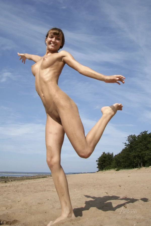 Picture by glambabes-galleries showing 'Totally naked teen strikes great solo poses while on a sandy beach' number 1