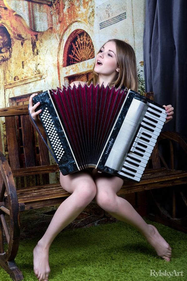 Picture by glambabes-galleries showing 'Sweet Euro teen Jeff Milton puts down her accordion for nude posing on bench' number 15