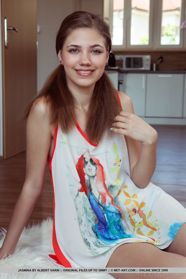 Picture by glambabes-galleries showing 'Sweet teen Jasmina tugs on her pigtails before getting totally naked on a rug' number 12