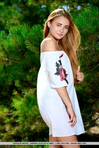 Sweet teen Gracia shows off her heavenly figure while naked afore fir trees