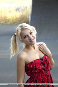Young blonde Gloia shows her tits and bald slit at a skateboard park