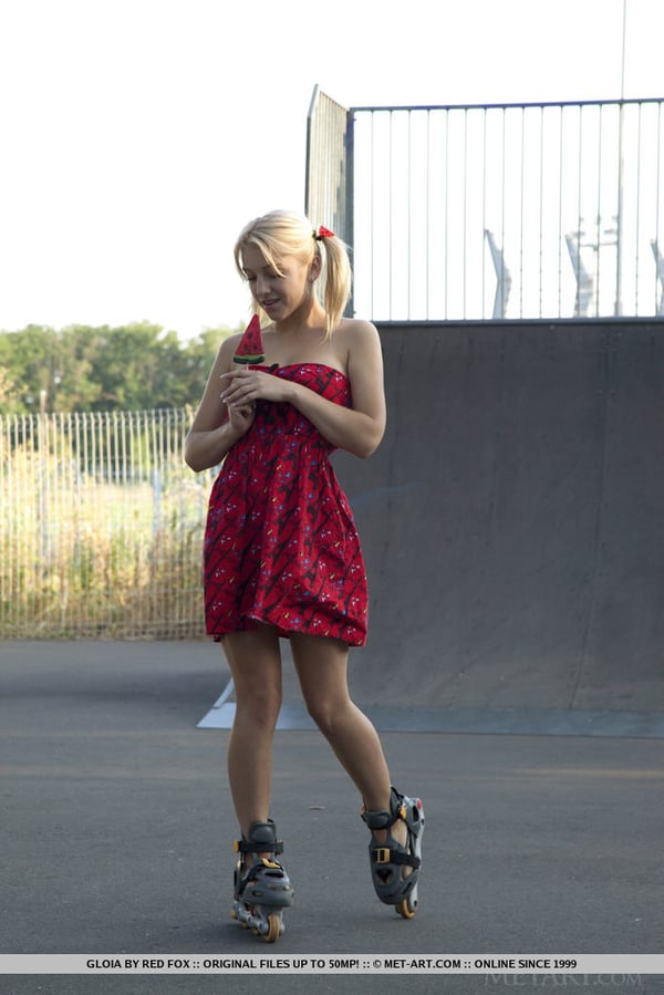 Picture by glambabes-galleries showing 'Young blonde Gloia shows her tits and bald slit at a skateboard park' number 17