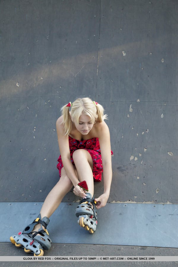 Picture by glambabes-galleries showing 'Young blonde Gloia shows her tits and bald slit at a skateboard park' number 14