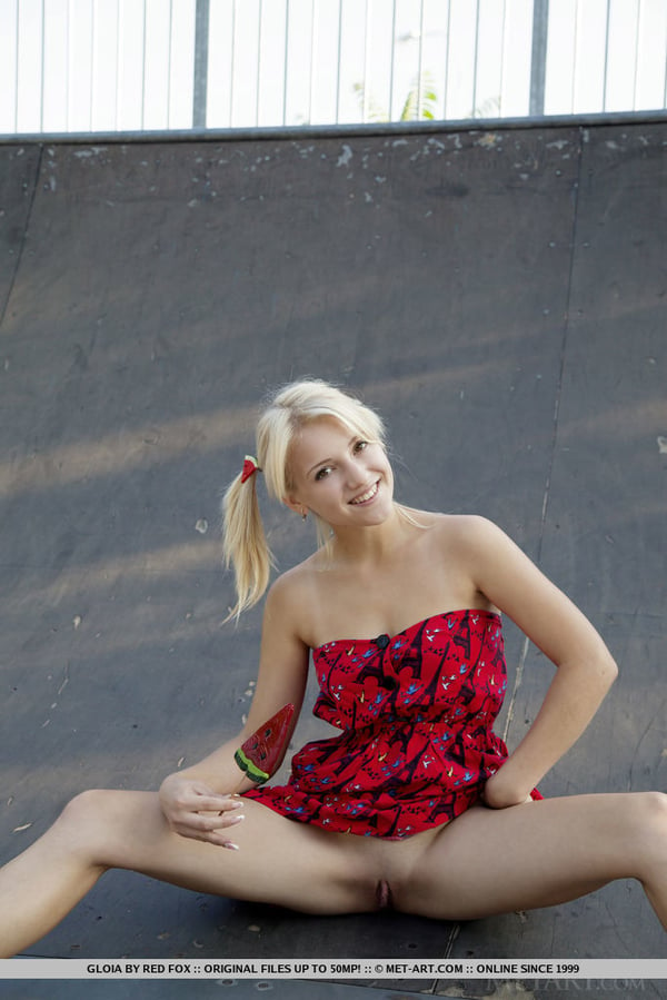 Picture by glambabes-galleries showing 'Young blonde Gloia shows her tits and bald slit at a skateboard park' number 9