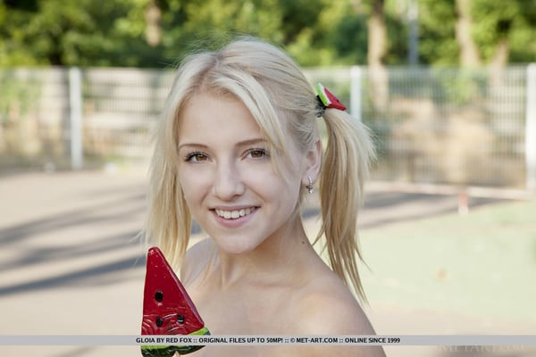 Picture by glambabes-galleries showing 'Young blonde Gloia shows her tits and bald slit at a skateboard park' number 18