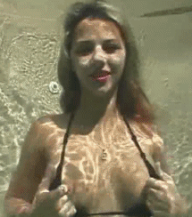 Hot babe showing tits underwater