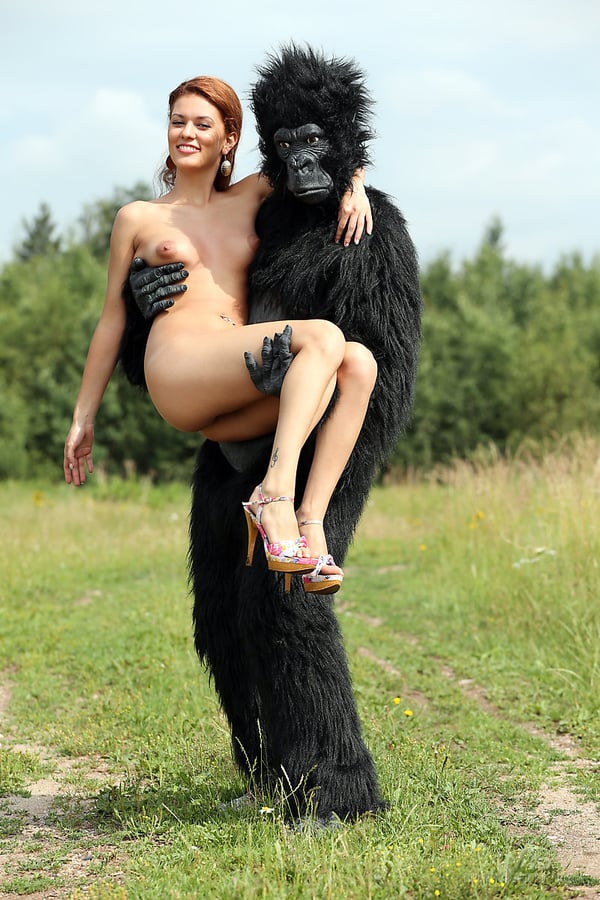Picture by glambabes-galleries showing 'Sexy redhead cosplay chick Becca romps nude outdoors in heels with gorilla' number 15
