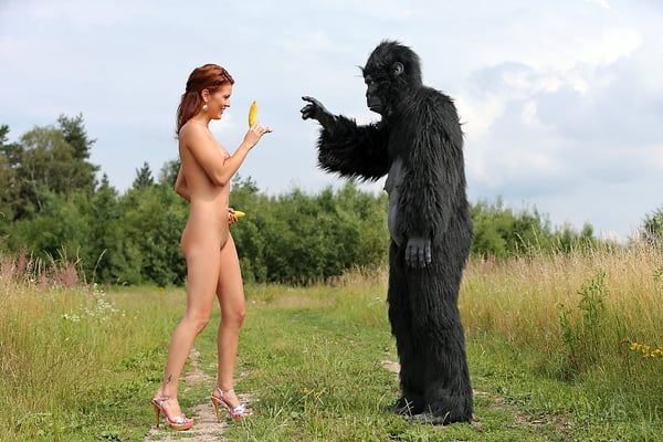 Picture by glambabes-galleries showing 'Sexy redhead cosplay chick Becca romps nude outdoors in heels with gorilla' number 13